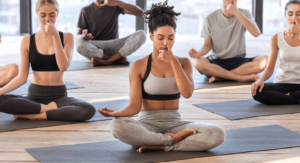 yoga students are performing a breathing exercise